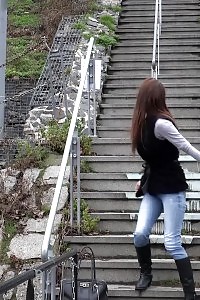 Naughty Black-haired Babe Pisses In Public On Some Steps