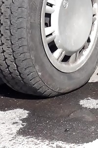 Enticing Black-haired Pisses Next To A Parked Van