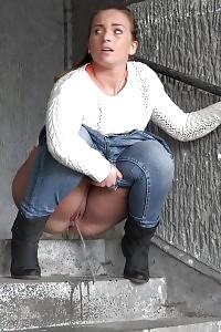 Black-haired Bitch In White Sweater Pisses Public