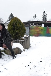 Engaging Black Haired Gal Pisses Out In The Snow