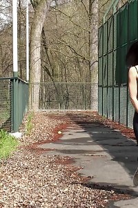 Astonishing Black Haired Babe Pissing In Public