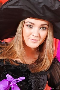 Intriguing, Big-breasted Blonde Strips Out Of Her Cosplay Costume And Looks A Tease In Her Lilac Undie And Black Nylons.